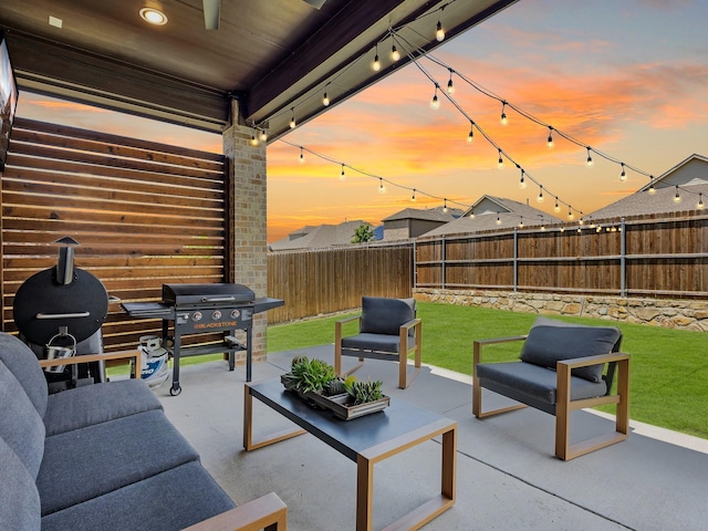 571 Mckenna Dr, Fate, TX 75087 - patio terrace at dusk with outdoor lounge area and area for grilling