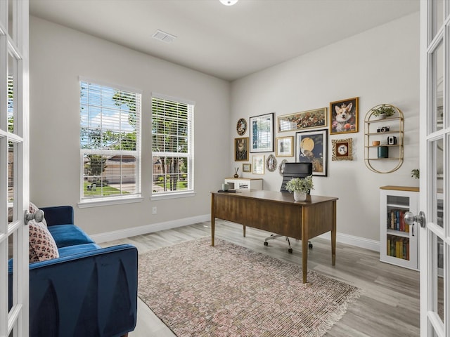 571 Mckenna Dr, Fate, TX 75087 - office featuring baseboards, light wood finished floors, and french doors