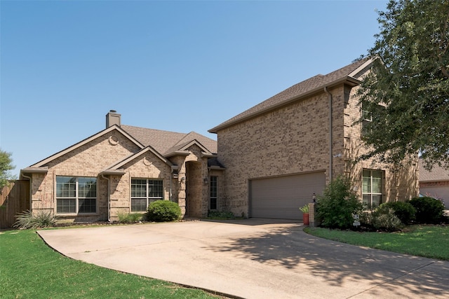 712 Britain Way, Wylie, TX 75098 - view of front facade featuring brick siding, concrete driveway, a chimney, a garage, and roof with shingles