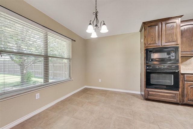 712 Britain Way, Wylie, TX 75098 - kitchen featuring black appliances, plenty of natural light, a chandelier, and hanging light fixtures