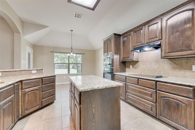 712 Britain Way, Wylie, TX 75098 - kitchen with under cabinet range hood, light tile patterned flooring, tasteful backsplash, and vaulted ceiling
