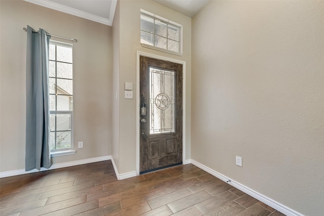 712 Britain Way, Wylie, TX 75098 - entryway with dark wood-style floors, baseboards, and ornamental molding