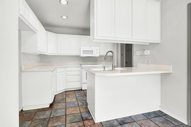 1407 W Mulberry St, Sherman, TX 75092 - kitchen with white microwave, stone finish flooring, a peninsula, stove, and light countertops