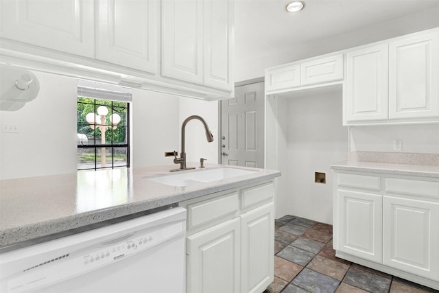 1407 W Mulberry St, Sherman, TX 75092 - kitchen featuring dishwasher, a sink, white cabinetry, light stone finish flooring, and light stone counters