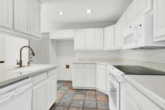 1407 W Mulberry St, Sherman, TX 75092 - kitchen with white appliances, a sink, recessed lighting, white cabinets, and light stone finish flooring