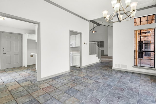 1407 W Mulberry St, Sherman, TX 75092 - empty room with baseboards, stone finish flooring, a chandelier, stairway, and lofted ceiling