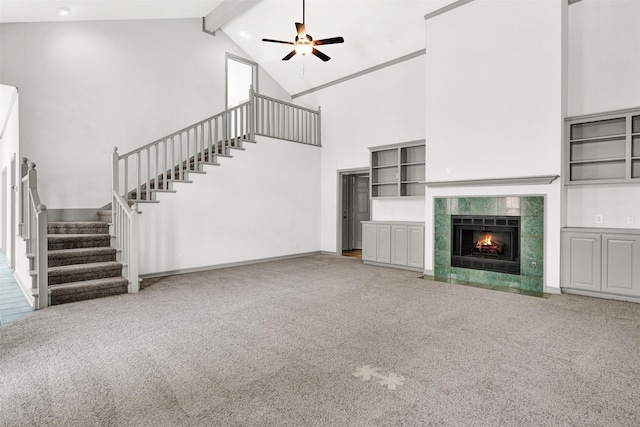 1407 W Mulberry St, Sherman, TX 75092 - unfurnished living room featuring high vaulted ceiling, carpet floors, stairs, beamed ceiling, and a ceiling fan