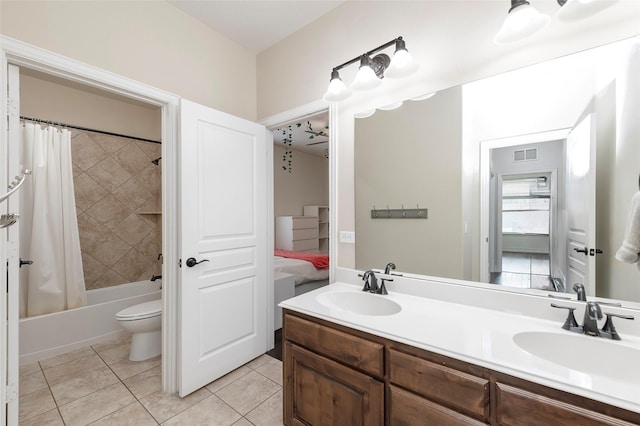 4416 Berry Ridge Ln, Frisco, TX 75036 - ensuite bathroom with double vanity, tile patterned floors, shower / tub combo with curtain, and toilet