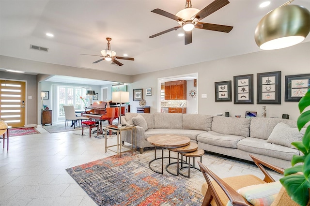 living area featuring ceiling fan, recessed lighting, and baseboards