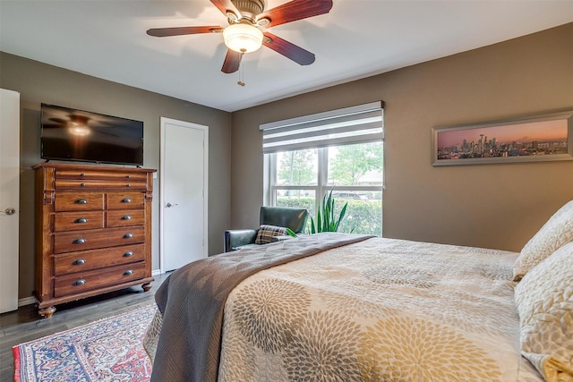 bedroom featuring wood finished floors and ceiling fan