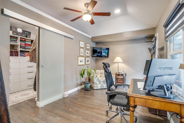 office space with ceiling fan, wood finished floors, baseboards, crown molding, and vaulted ceiling