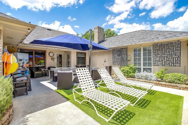 view of front of house with an outdoor hangout area, a patio, a shingled roof, and a chimney