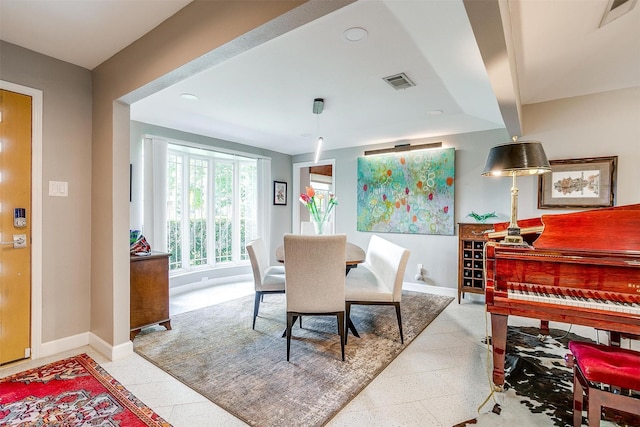 dining area featuring baseboards and recessed lighting