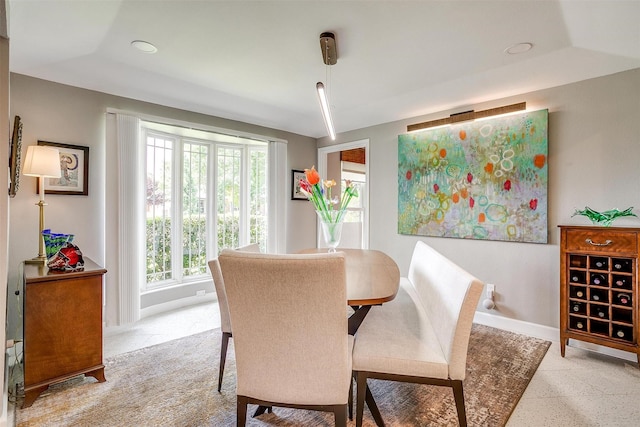 dining room with baseboards and recessed lighting