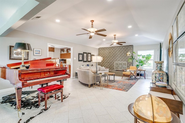 living area featuring recessed lighting, a ceiling fan, baseboards, lofted ceiling, and a brick fireplace