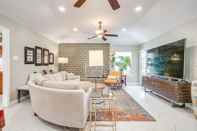 living room featuring a ceiling fan, baseboards, vaulted ceiling, recessed lighting, and dark speckled floor