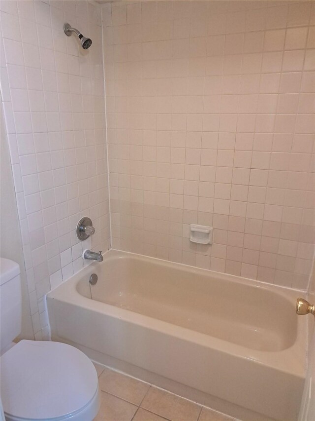 327 Trevino Trl, Lancaster, TX 75146 - bathroom with toilet, tile patterned floors, and shower / tub combination
