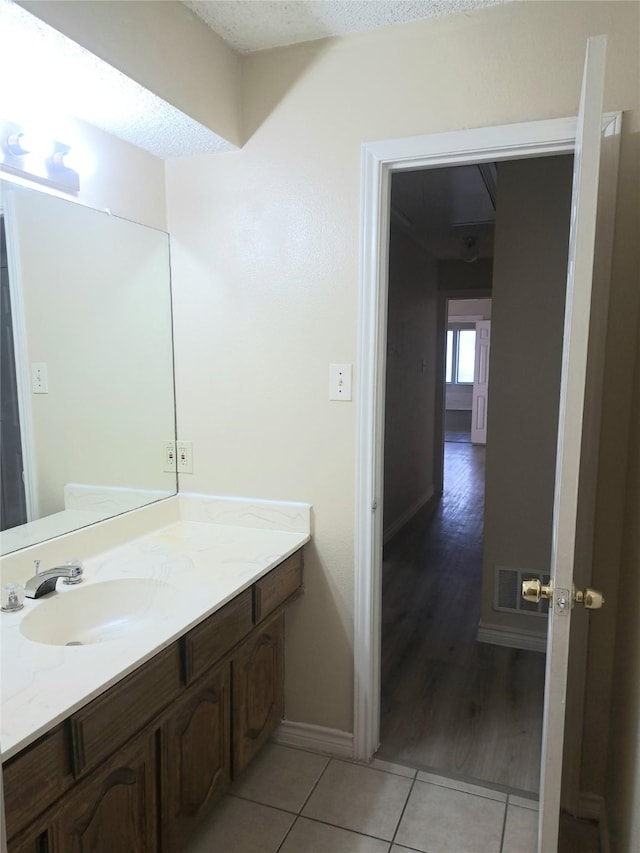 327 Trevino Trl, Lancaster, TX 75146 - bathroom featuring tile patterned flooring, vanity, and baseboards