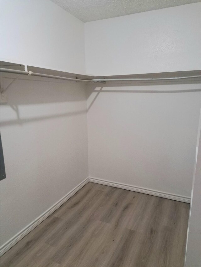 327 Trevino Trl, Lancaster, TX 75146 - spacious closet with wood finished floors
