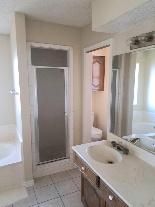 327 Trevino Trl, Lancaster, TX 75146 - full bathroom featuring a shower stall, tile patterned floors, a bath, and a textured ceiling