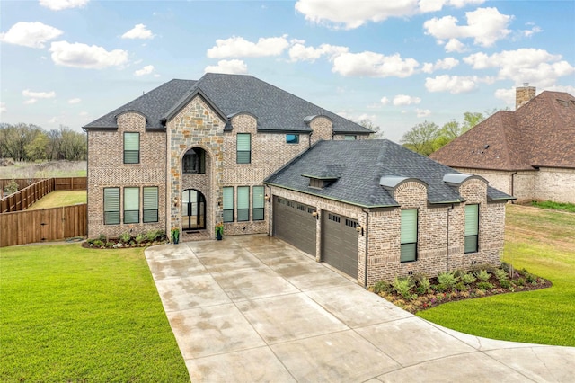 105 Shawnee Trl, Pottsboro, TX 75076 - french provincial home featuring brick siding, an attached garage, concrete driveway, and a shingled roof