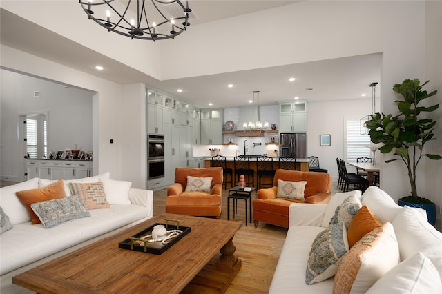 105 Shawnee Trl, Pottsboro, TX 75076 - living room with a chandelier, light wood-style floors, and recessed lighting