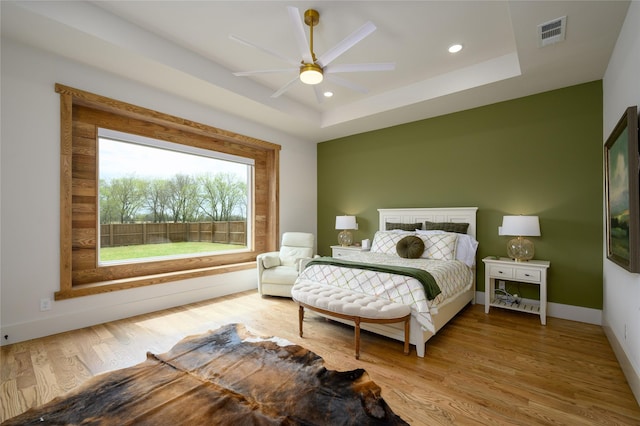 105 Shawnee Trl, Pottsboro, TX 75076 - bedroom with wood finished floors, a raised ceiling, recessed lighting, baseboards, and ceiling fan