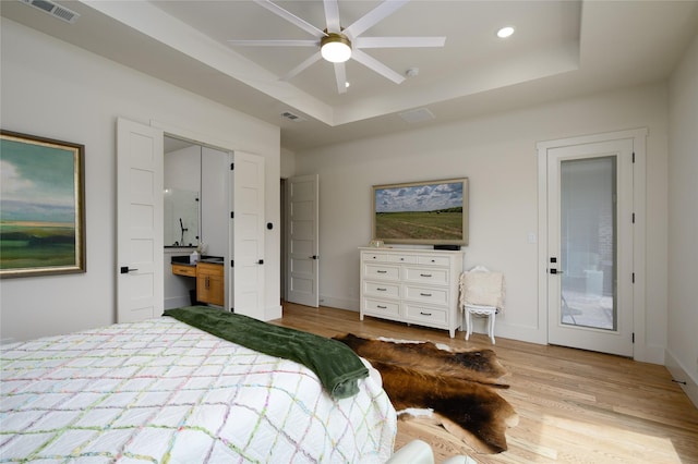105 Shawnee Trl, Pottsboro, TX 75076 - bedroom featuring wood finished floors, a tray ceiling, recessed lighting, and baseboards