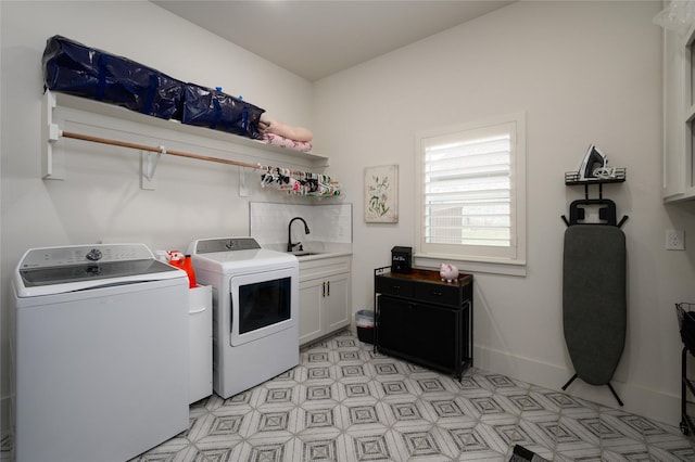 105 Shawnee Trl, Pottsboro, TX 75076 - clothes washing area with cabinet space, washing machine and dryer, light floors, and baseboards