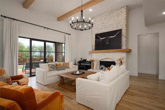 105 Shawnee Trl, Pottsboro, TX 75076 - living area featuring a chandelier, a high ceiling, beam ceiling, light wood-type flooring, and a fireplace