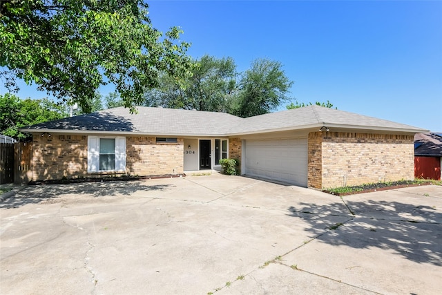 5304 Weddington Ct, Fort Worth, TX 76133 - ranch-style home with brick siding, an attached garage, and concrete driveway