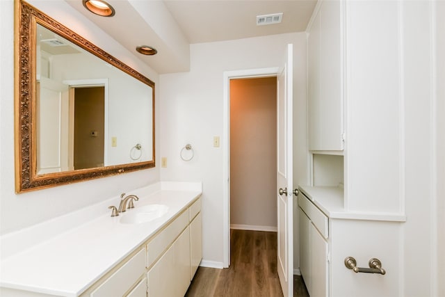 5304 Weddington Ct, Fort Worth, TX 76133 - bathroom with wood finished floors, vanity, and baseboards