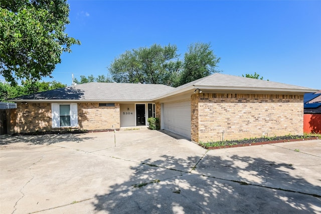 5304 Weddington Ct, Fort Worth, TX 76133 - ranch-style house with brick siding, concrete driveway, and an attached garage