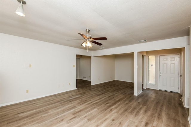 5304 Weddington Ct, Fort Worth, TX 76133 - unfurnished living room featuring wood finished floors, a ceiling fan, and baseboards