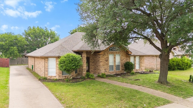 208 N Rustic Trl, Wylie, TX 75098 - view of front of home with brick siding, driveway, and a shingled roof