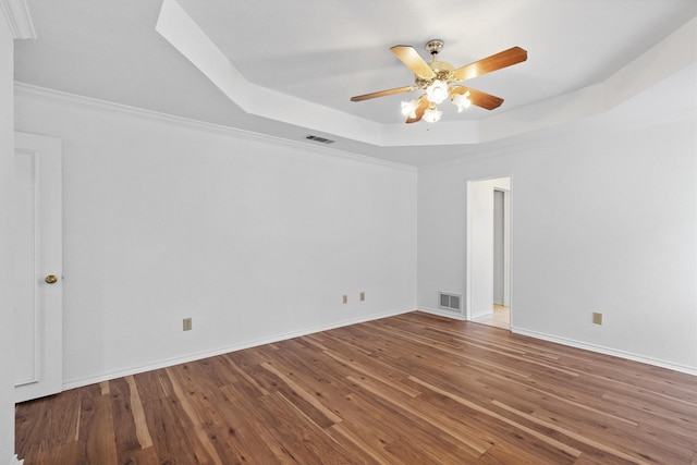 208 N Rustic Trl, Wylie, TX 75098 - spare room with a raised ceiling, wood finished floors, a ceiling fan, and baseboards