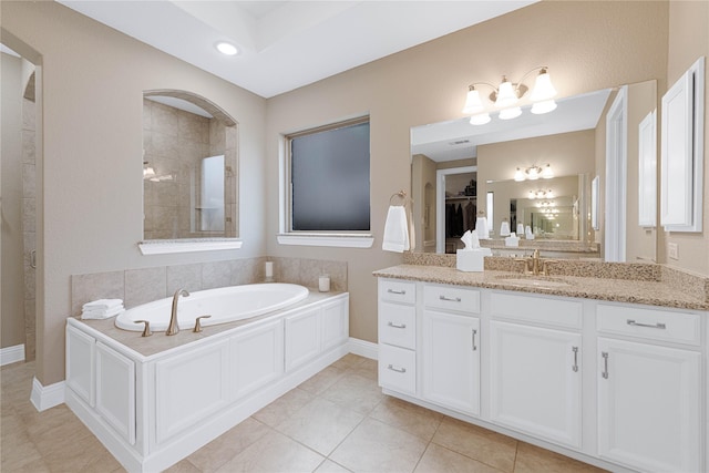 331 Sagemeadow Rd, Wylie, TX 75098 - bathroom featuring tile patterned flooring, a bath, vanity, a tile shower, and baseboards