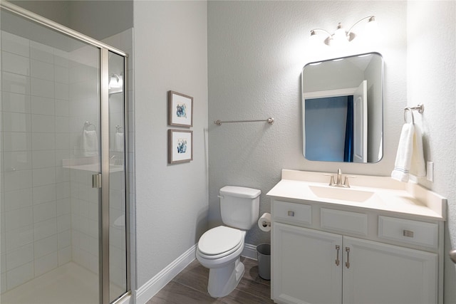 331 Sagemeadow Rd, Wylie, TX 75098 - bathroom featuring a shower stall, toilet, wood finished floors, and vanity