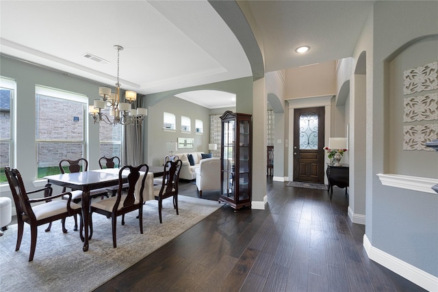 331 Sagemeadow Rd, Wylie, TX 75098 - dining room featuring a chandelier, baseboards, dark wood-style flooring, arched walkways, and recessed lighting