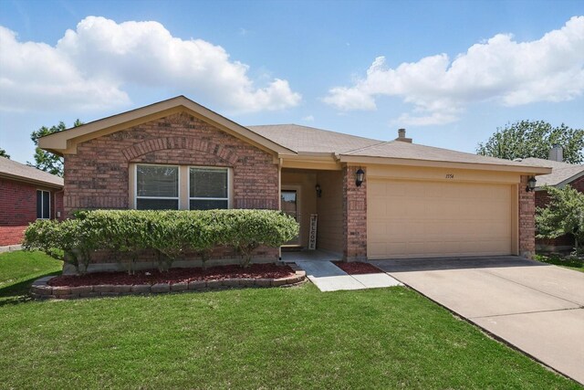 1554 Brandywine Ln, Little Elm, TX 75068 - ranch-style house with brick siding, a garage, a front yard, and driveway