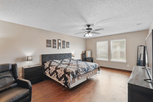 1554 Brandywine Ln, Little Elm, TX 75068 - bedroom featuring wood finished floors, ceiling fan, a textured ceiling, and baseboards