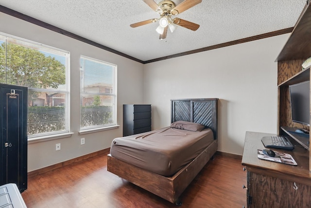 1554 Brandywine Ln, Little Elm, TX 75068 - bedroom featuring wood finished floors, a textured ceiling, ornamental molding, baseboards, and ceiling fan