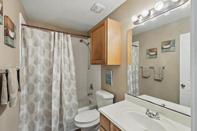 1554 Brandywine Ln, Little Elm, TX 75068 - bathroom with toilet, a textured ceiling, shower / tub combo with curtain, and vanity