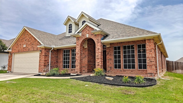 10252 Red Bluff Ln, Fort Worth, TX 76177 - traditional-style house featuring brick siding, a shingled roof, an attached garage, and concrete driveway