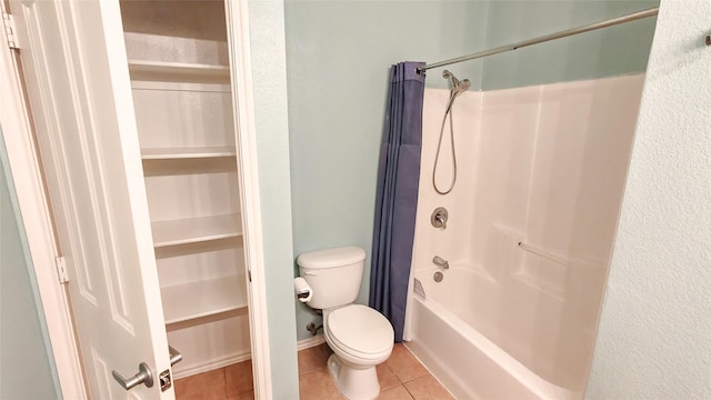 10252 Red Bluff Ln, Fort Worth, TX 76177 - bathroom with tile patterned flooring, shower / bathtub combination with curtain, and a walk in closet