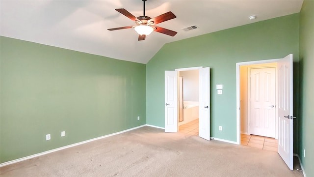 10252 Red Bluff Ln, Fort Worth, TX 76177 - unfurnished bedroom with vaulted ceiling, carpet, ensuite bath, tile patterned flooring, and ceiling fan