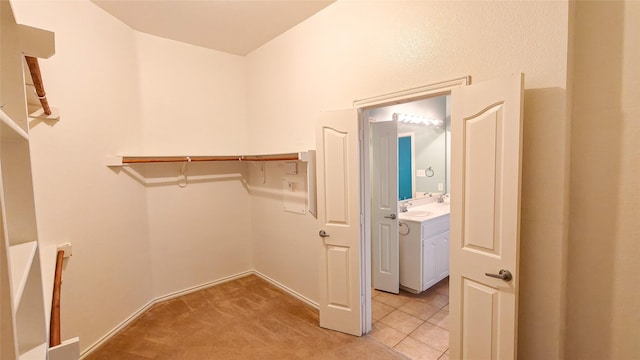10252 Red Bluff Ln, Fort Worth, TX 76177 - walk in closet featuring light tile patterned floors and light carpet