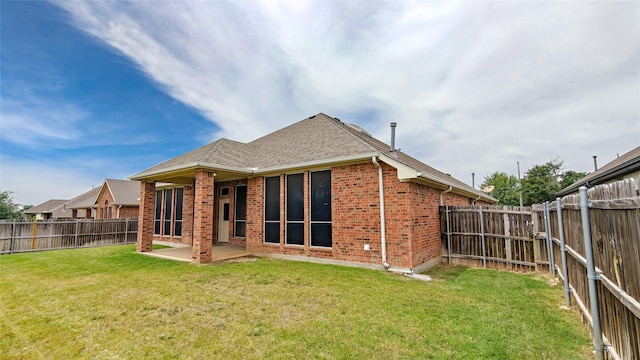 10252 Red Bluff Ln, Fort Worth, TX 76177 - rear view of house with brick siding, a patio, a fenced backyard, and a shingled roof