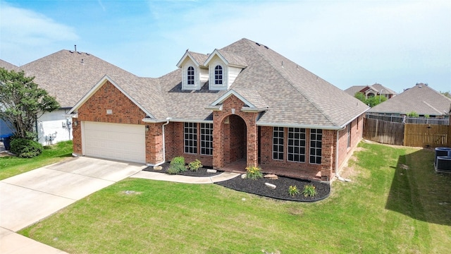 10252 Red Bluff Ln, Fort Worth, TX 76177 - traditional home with brick siding, an attached garage, a shingled roof, and concrete driveway