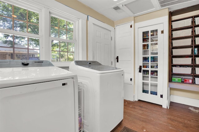 820 W Gandy St, Denison, TX 75020 - washroom with independent washer and dryer and dark wood-style flooring